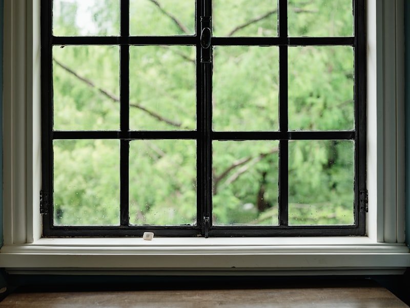 Large fixed picture window framing greenery